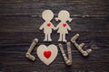 Cardboard silhouettes girl and boy with hearts and the word love