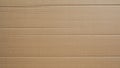 Cardboard texture, Paper box or packing paper, Brown horizontal corrugated and folded use for background, Close up.