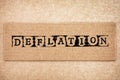 Cardboard with word Deflation