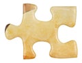 Cardboard yellow piece of jigsaw puzzle close up