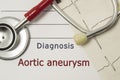 Cardiac diagnosis of Aortic aneurysm. On doctor workplace are red stethoscope, printed on paper ECG line and a pen close-up lying Royalty Free Stock Photo