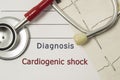 Cardiac diagnosis of Cardiogenic Shock. On doctor workplace are red stethoscope, printed on paper ECG line and a pen close up lyin Royalty Free Stock Photo