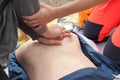 Cardiac massage and artificial respiration on a mannequin