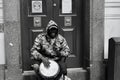 Black and white image of a street musician in Queen Street Cardiff