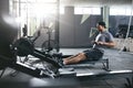 Cardio Training. Sports Man Exercising On Rowing Machine At Gym Royalty Free Stock Photo