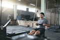 Cardio Training. Sports Man Exercising On Rowing Machine At Gym Royalty Free Stock Photo