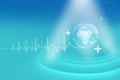 Cardiogram pattern and globe on medical blue futuristic background - great for healthcare news topic