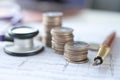 Cardiogram stethoscope and coins lie on table