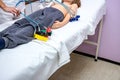 Nurse is preparing a child, teenager patient for ECG or EKG test Royalty Free Stock Photo