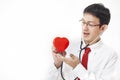 Cardiologist checking red heart with stethoscope. cardiology con