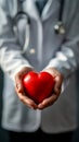 Cardiologist doctor holding a red heart in his hands Royalty Free Stock Photo