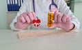 Cardiologist doctor holds medical pills in shape of heart