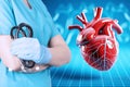 Cardiologist looking at a red heart. Medical Poster Royalty Free Stock Photo