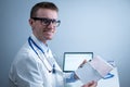 Cardiologist reading an ECG print-out. Doctor analyzing electrocardiogram. Practitioner examine patient test results