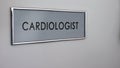 Cardiologist room door in hospital, heart disease, healthcare and lifestyle