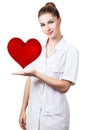 Cardiologist woman doctor holding big red heart.
