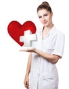 Cardiologist woman doctor holding big red heart.