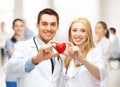 Cardiologists with heart Royalty Free Stock Photo