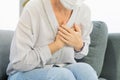 Cardiology, angina caucasian mature woman hand hold chest with pain and suffer, having heart attack, hurt sudden coronary symptom