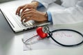Cardiology - doctor cardiologist working on laptop in office Royalty Free Stock Photo