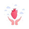 Cardiology, heart disease and organ donation concept. Vector flat illustration. Human hand holding anatomical human heart symbol Royalty Free Stock Photo