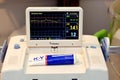 Cardiotocography device placed on mother\'s abdomen recording the fetal heart rate obtained via ultrasound transducer