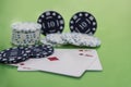 Cards and chips on green and yellow casino table. Abstract casino gambling photo