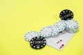 Cards and chips on green and yellow casino table. Abstract casino gambling photo
