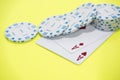 Cards and chips on green and yellow casino table. Abstract casino gambling photo