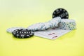 Cards and chips on green and yellow casino table. Abstract casino gambling photo