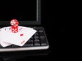 Cards, dice beside the keyboard. online card games concept Royalty Free Stock Photo