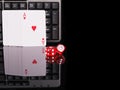 Cards, dice beside the keyboard. online card games concept Royalty Free Stock Photo