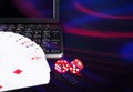 Cards, dice beside the keyboard. online card games concept Royalty Free Stock Photo