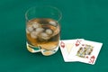 Cards and a glass of whisky.