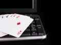 Cards beside the keyboard. online card games concept Royalty Free Stock Photo