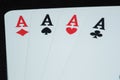 Cards laid four aces hearts diamonds space cross side by side closeup macro view of cards on black background