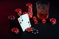 Cards of poker player. On the table are chips and a glass of cocktail with whiskey. Cards - Ace and jack Royalty Free Stock Photo