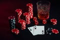 Cards of poker player. On the table are chips and a glass of cocktail with whiskey. Cards - Ace and jack Royalty Free Stock Photo