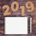 Cardstock Numbers 2019 Happy New Year Sign near White Spiral Pap Royalty Free Stock Photo