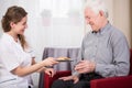 Care assistant and retired man Royalty Free Stock Photo