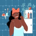 Daily care of dental health. Dark skinned afro girl is flossing her teeth with dental floss in the bathroom. Morning and evening Royalty Free Stock Photo