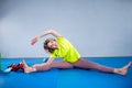 Care of flexibility. Woman practicing yoga on the floor. Stretching exercise. Fitness and body care. Physical therapy. Yoga class