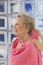 Care giver or nurse assisting elderly woman for shower Royalty Free Stock Photo