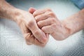Care is at home of elderly. Old people holding hands. Royalty Free Stock Photo