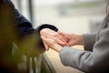 Close-up of young female hands holding senior woman hands Royalty Free Stock Photo