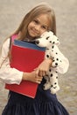 Care and trust. Preschool child hug toy dog. Back to school supplies. Preschool education. Afterschool care. Daycare and Royalty Free Stock Photo