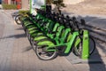 Careem eco-friendly green bike rentals in a row at the Dubai Marina Jumeriah are Royalty Free Stock Photo