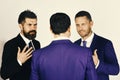 Career and competition concept. Men with beard and persuasive faces discuss business. CEOs have dispute and meeting on