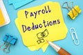 Career concept meaning Payroll Deductions with phrase on the piece of paper