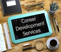 Career Development Services Handwritten on Small Chalkboard. 3D. Royalty Free Stock Photo